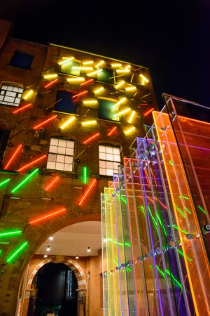 Neon Sculpture and Mise-en-abyme sculpture (foreground) by De Allegri and Fogale behind Oxo Tower