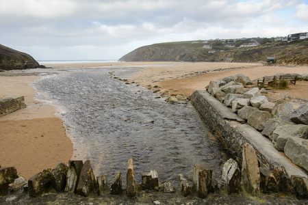 The River Menalhyl discharges into the sea.