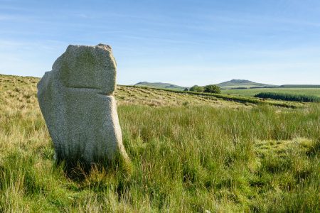 One of the Stripple Stones with Rough Tor and Brown Willy in the background.